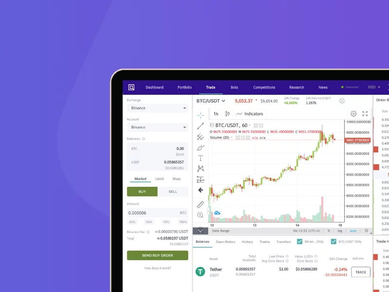 Crypto trading interface on a laptop showing Bitcoin to USDT chart and live trading features on Binance.